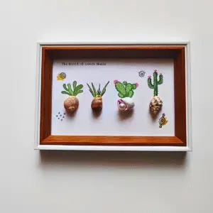 Framed coastal art with boat and tree scene