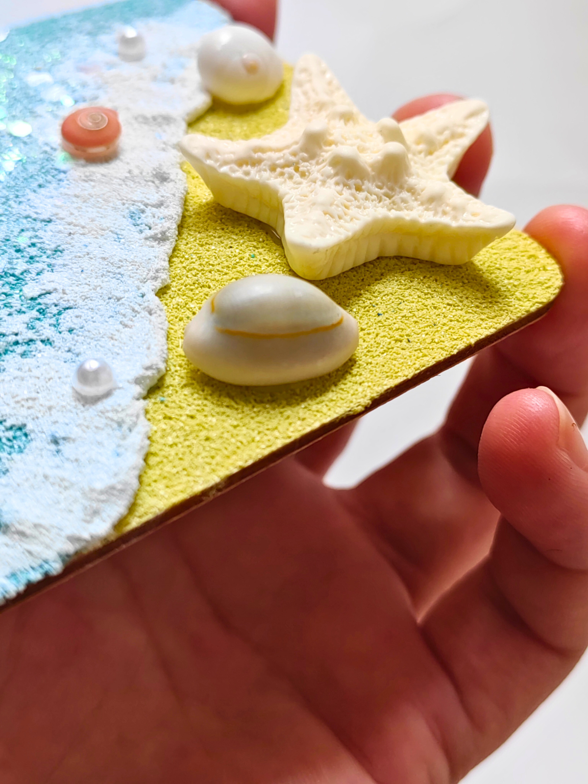 Lavender wood ocean magnet on refrigerator door