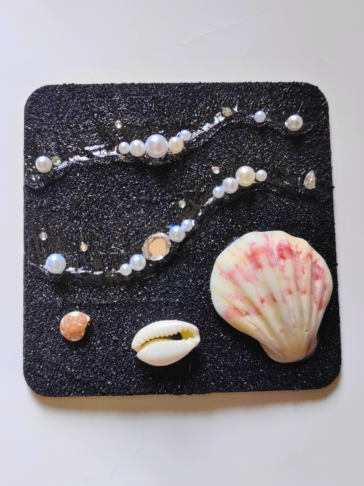 Square ocean magnet with shell art on black wood