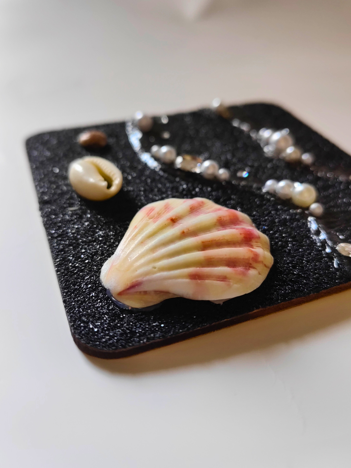 Handcrafted seashell magnet with natural shell details