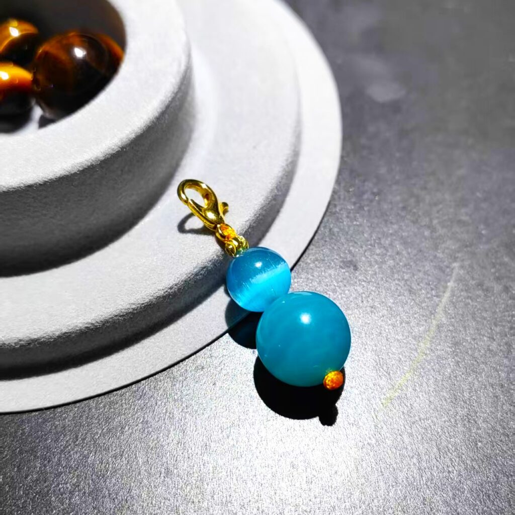 Polished blue-green beads with subtle translucency, natural light