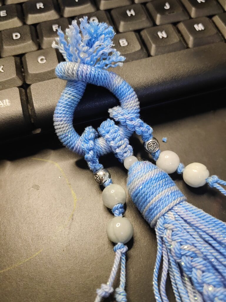 close up of hand knotted tassel using 1.2cm hand twisted cotton cord