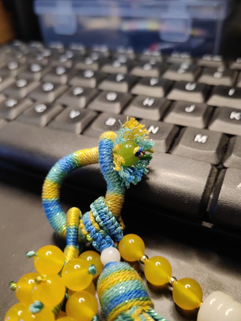 close up of hand knotted tassel using 1.0mm jade cord