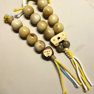 Handheld fidget with eight 24mm natural bodhi beads, double-hole sandalwood bead and colorful tassels